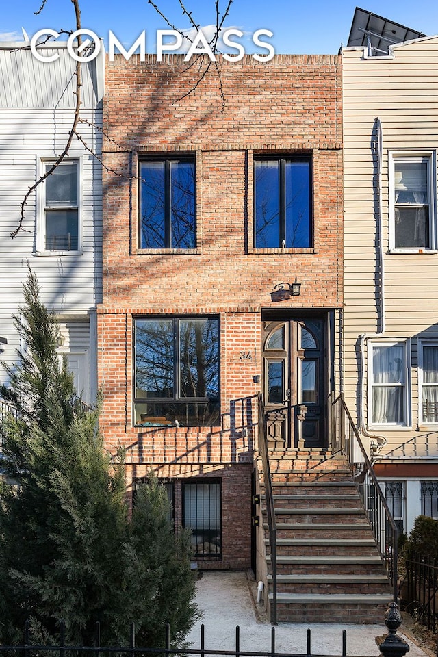 view of property with brick siding