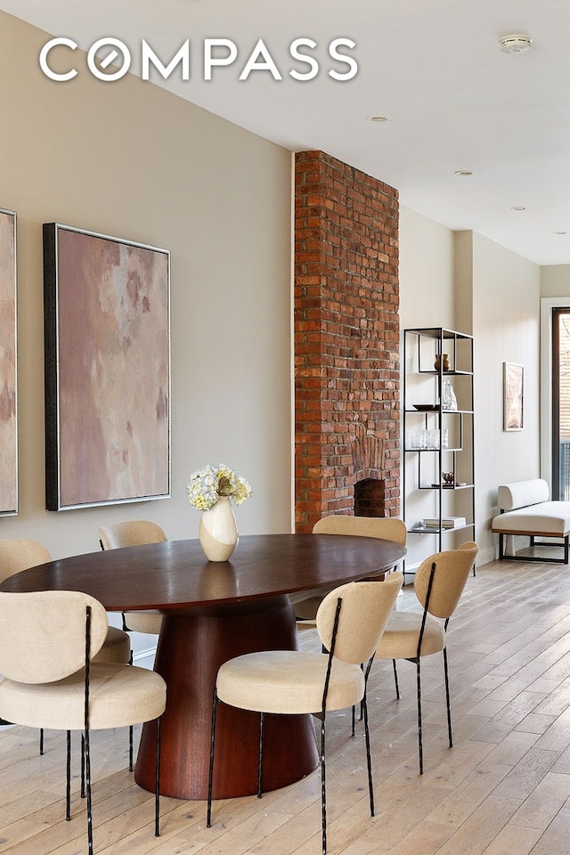 dining space featuring light wood finished floors