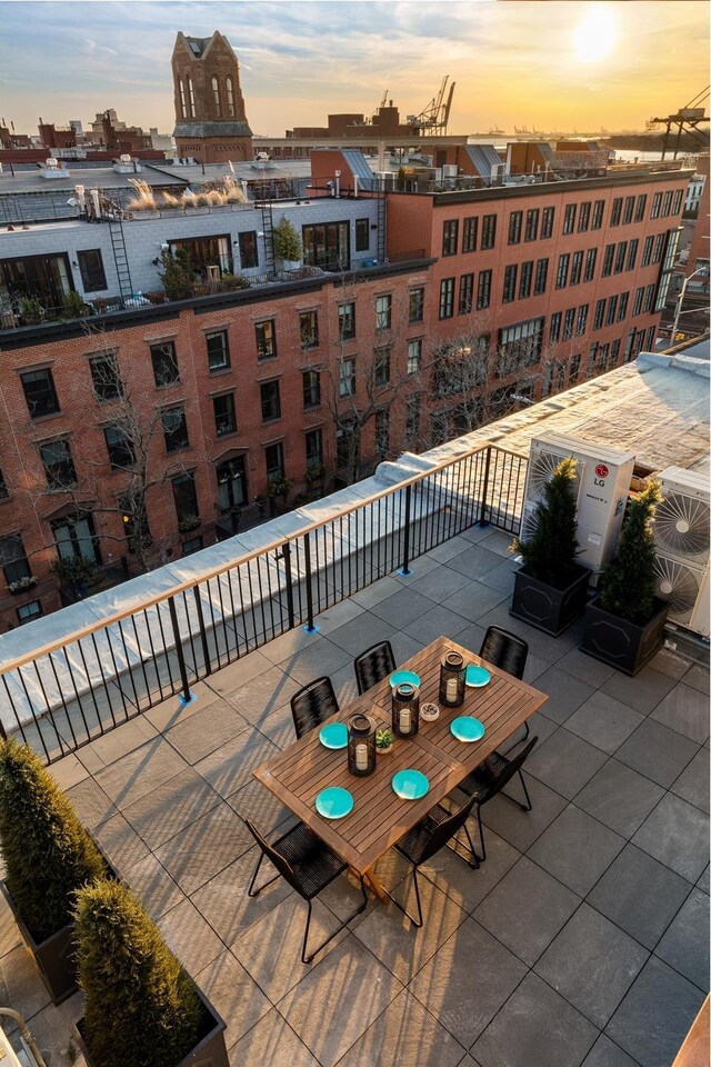 view of patio / terrace featuring a city view