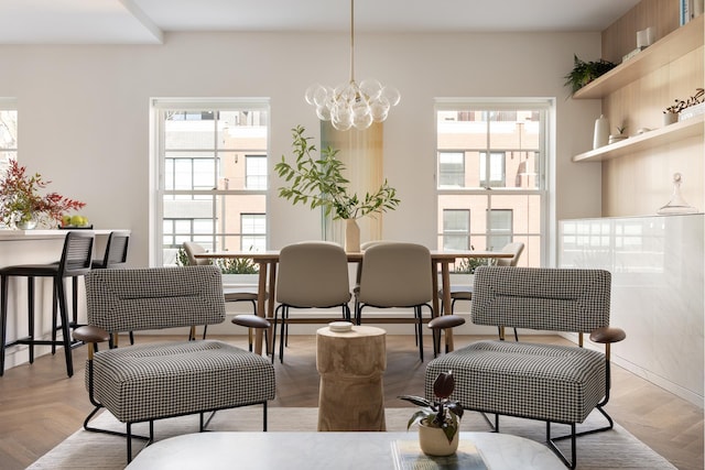 dining area featuring an inviting chandelier and plenty of natural light