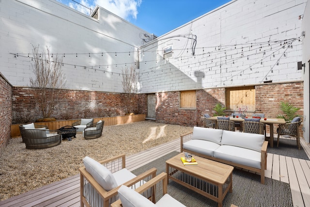 wooden deck with fence private yard and outdoor lounge area