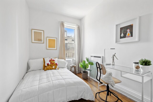 bedroom featuring wood finished floors