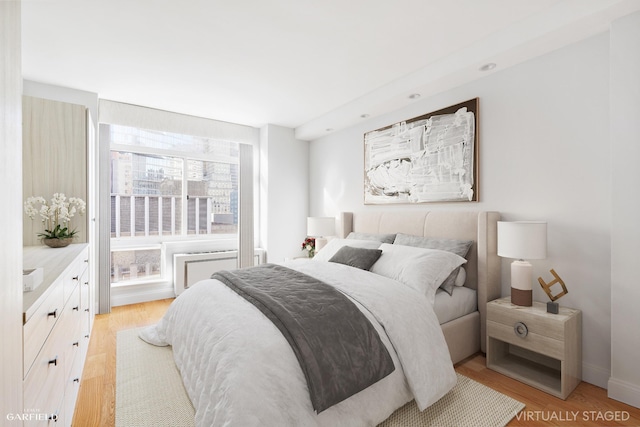 bedroom featuring light wood-style floors