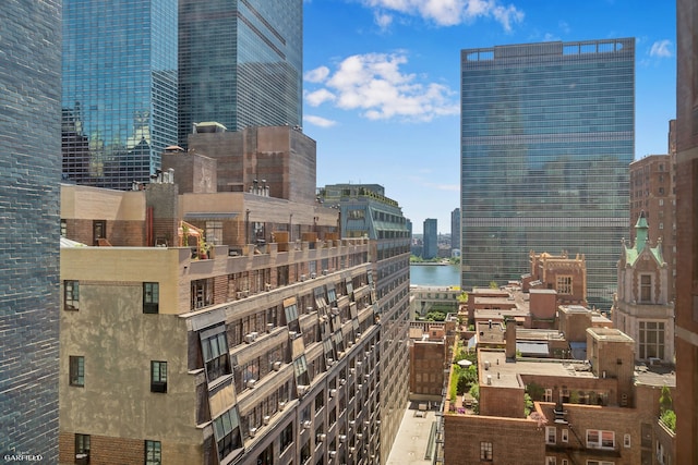 property's view of city featuring a water view