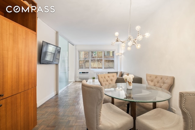 dining room with an inviting chandelier, baseboards, and a wall mounted air conditioner