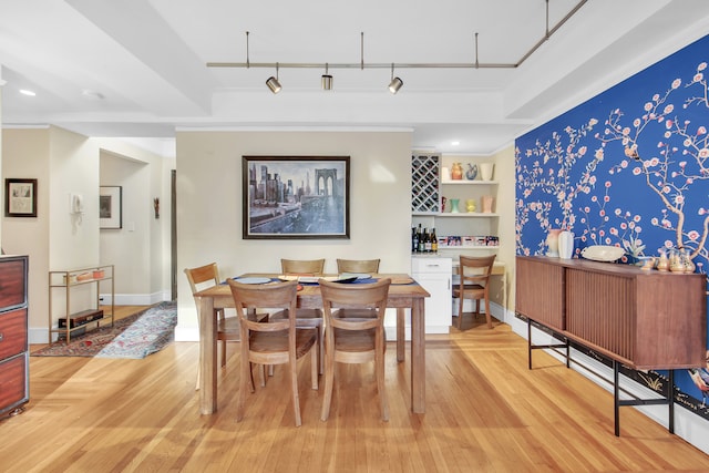 227 E 57th St Unit 9Fg, New York City, NY 10022 - dining space featuring crown molding, recessed lighting, light wood-style floors, track lighting, and baseboards
