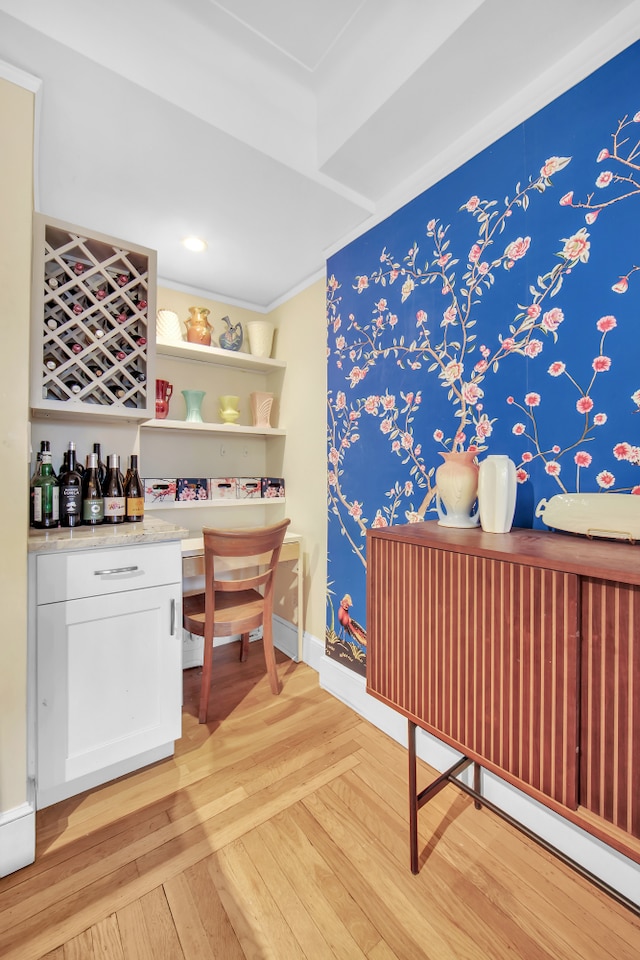 227 E 57th St Unit 9Fg, New York City, NY 10022 - bar area featuring light wood-style floors