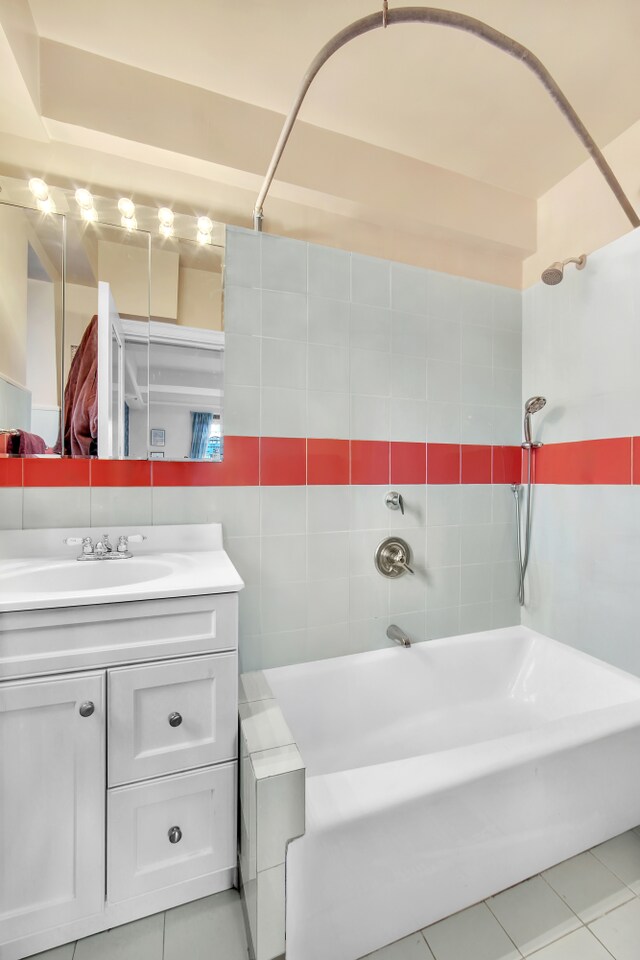 227 E 57th St Unit 9Fg, New York City, NY 10022 - full bath with tile patterned flooring, tub / shower combination, and vanity