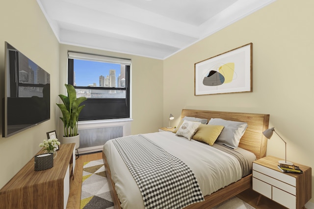 227 E 57th St Unit 9Fg, New York City, NY 10022 - bedroom with wood finished floors and crown molding