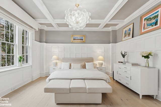 37 W 93rd St Unit 17/13, New York City, NY 10025 - bedroom with a decorative wall, coffered ceiling, a chandelier, multiple windows, and light wood-type flooring