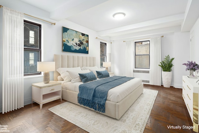 bedroom with beam ceiling and baseboards