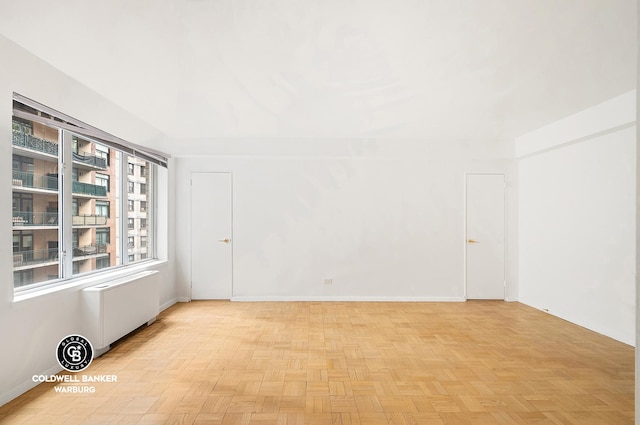 200 E 57th St Unit 9G, New York City, NY 10022 - empty room featuring radiator heating unit and baseboards