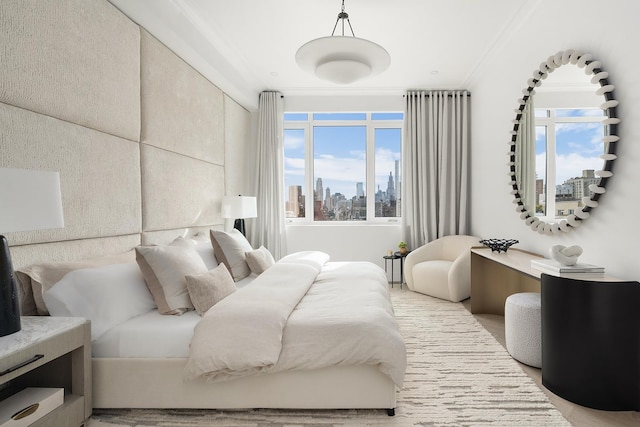 bedroom featuring a view of city and crown molding