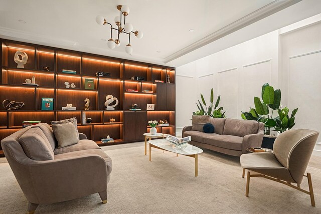 126 E 86th St Unit 17A, New York City, NY 10028 - interior space with light carpet, a chandelier, crown molding, and a decorative wall