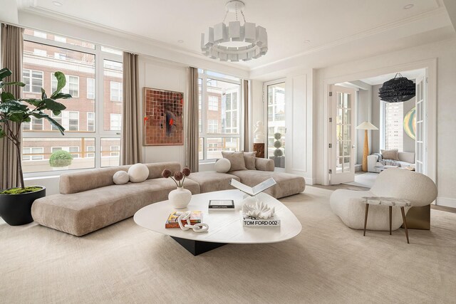 126 E 86th St Unit 17A, New York City, NY 10028 - carpeted living area with a notable chandelier and ornamental molding