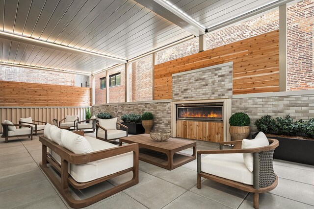126 E 86th St Unit 17A, New York City, NY 10028 - view of patio with an outdoor living space with a fireplace and fence