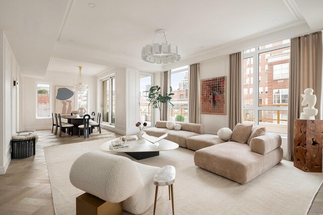 126 E 86th St Unit 17A, New York City, NY 10028 - living room with an inviting chandelier, baseboards, and ornamental molding