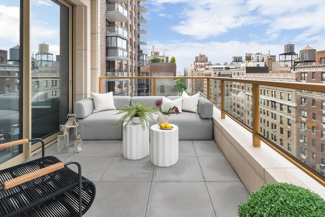 balcony with a view of city and outdoor lounge area