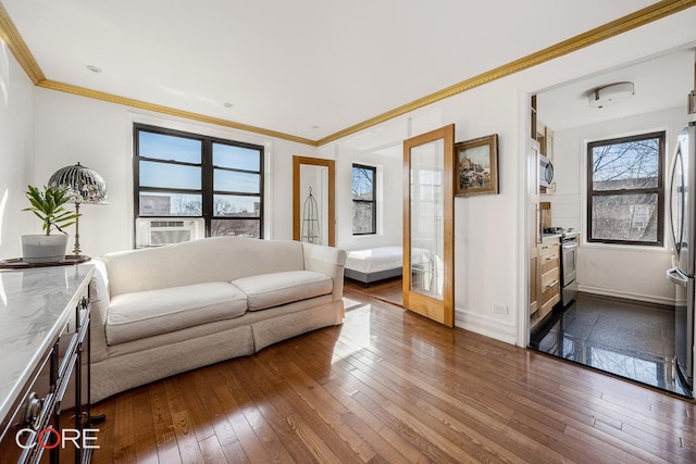 living area featuring cooling unit, dark wood-type flooring, baseboards, ornamental molding, and french doors