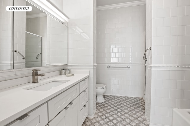 bathroom featuring vanity, walk in shower, tile walls, and crown molding