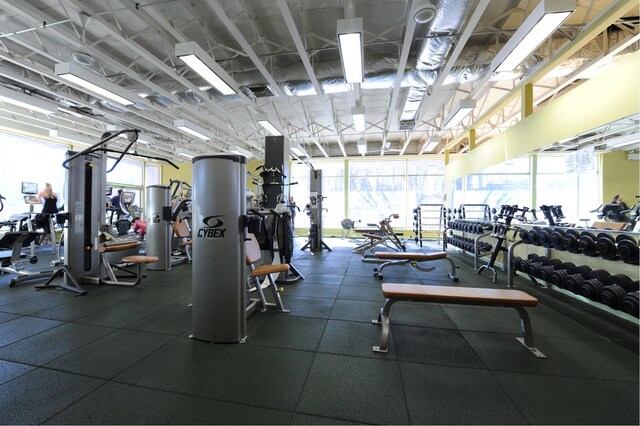 exercise room with visible vents and a healthy amount of sunlight