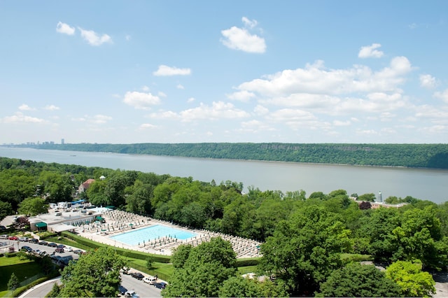 bird's eye view with a water view and a forest view