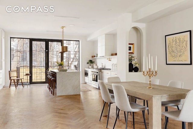 dining space featuring french doors