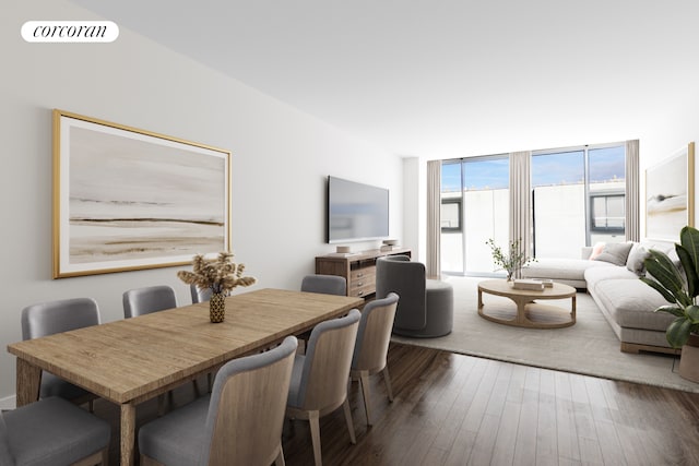 dining space featuring wood finished floors and expansive windows