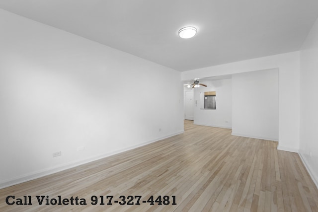 34-40 78th St Unit 4H, New York City, NY 11372 - unfurnished room with baseboards, ceiling fan, and light wood-style flooring