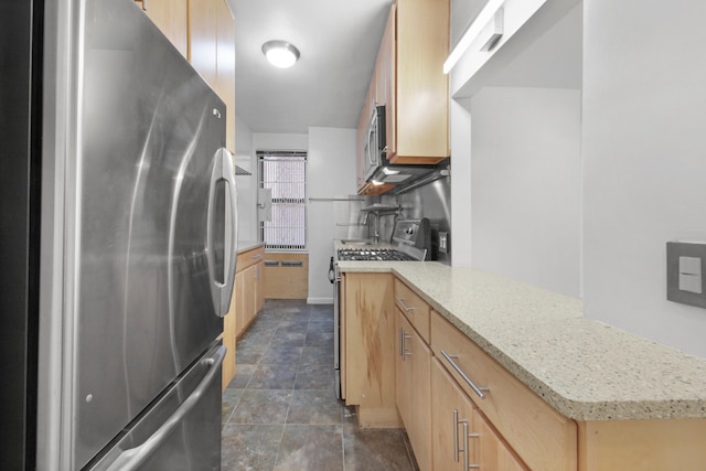 34-40 78th St Unit 4H, New York City, NY 11372 - kitchen with a peninsula, stainless steel appliances, light brown cabinetry, and light stone counters