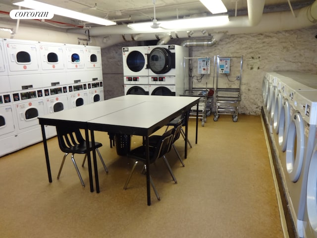 interior space with washer and clothes dryer and stacked washer / drying machine