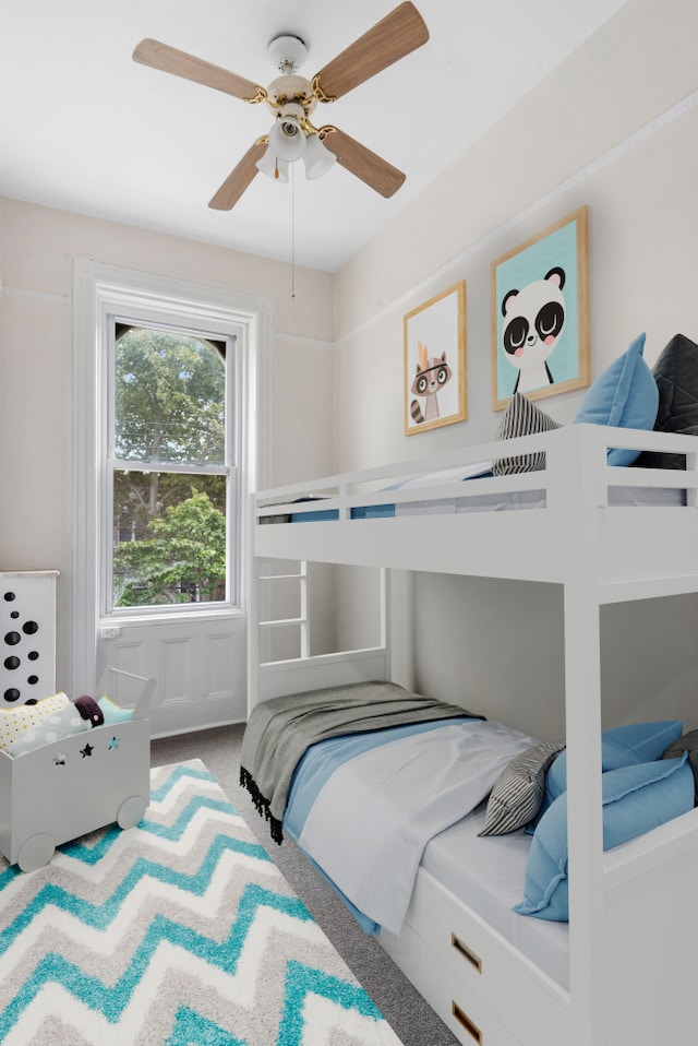 bedroom with ceiling fan and carpet