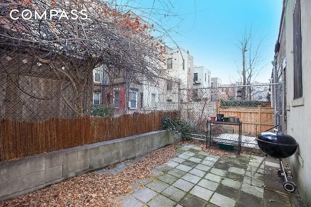 view of patio / terrace featuring fence and area for grilling