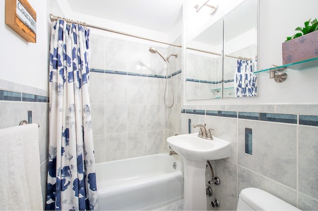 5900 Arlington Ave Unit 2S, New York City, NY 10471 - full bathroom featuring shower / bath combo with shower curtain, toilet, and tile walls