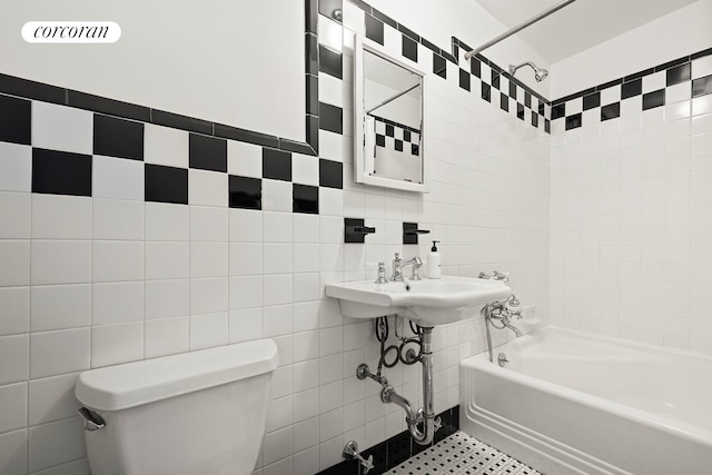 full bath featuring toilet, tile walls, and shower / bathing tub combination