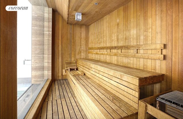 70 Little W St Unit 22G, New York City, NY 10280 - relaxing sauna / steam room featuring wooden walls and wood ceiling