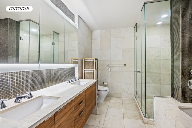 70 Little W St Unit 22G, New York City, NY 10280 - full bath featuring tile walls, a stall shower, double vanity, toilet, and a bath