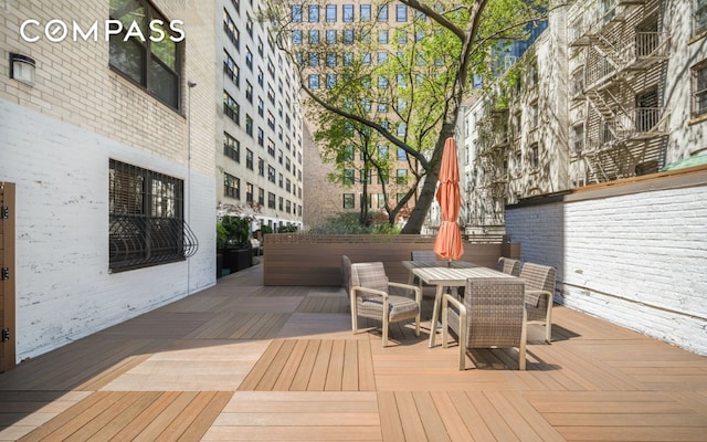 wooden deck with outdoor dining space