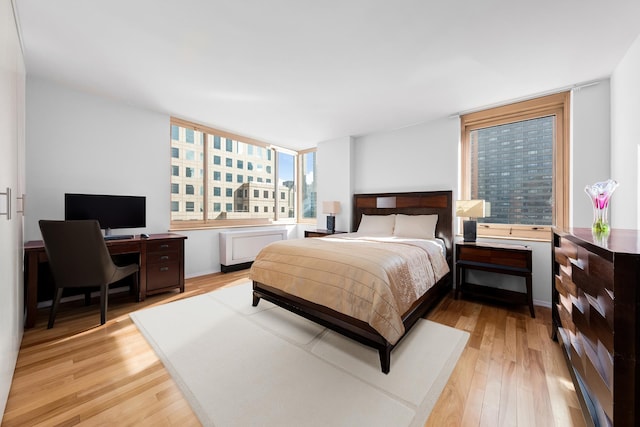 bedroom featuring light wood-style flooring