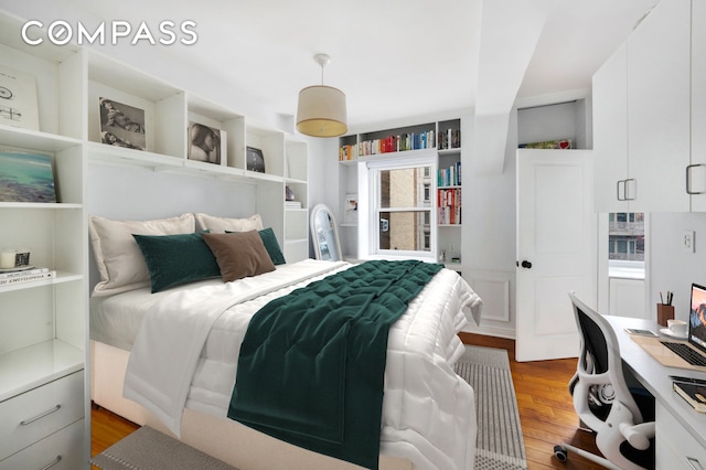 bedroom featuring light wood-style flooring