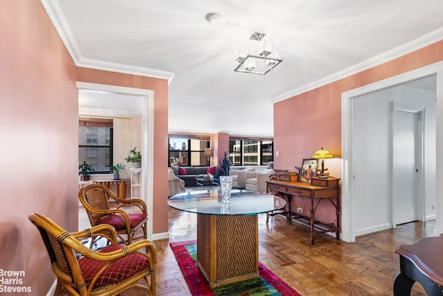 dining area with baseboards and crown molding