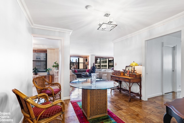 305 E 40th St Unit 17Jk, New York City, NY 10017 - dining area featuring crown molding, a chandelier, and baseboards