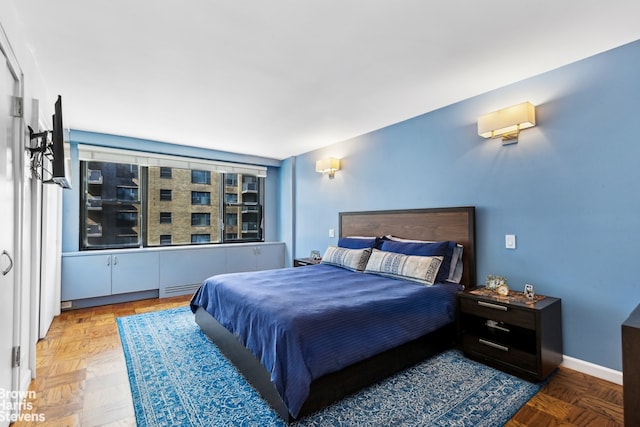 bedroom featuring baseboards