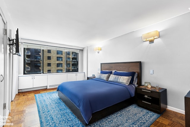 305 E 40th St Unit 17Jk, New York City, NY 10017 - bedroom featuring baseboards