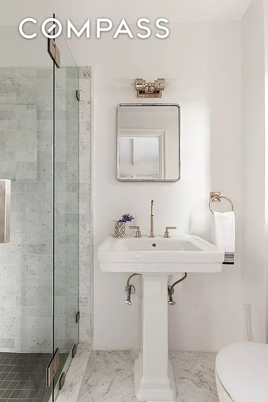 151 E 83rd St Unit 5E, New York City, NY 10028 - full bathroom with a stall shower and marble finish floors