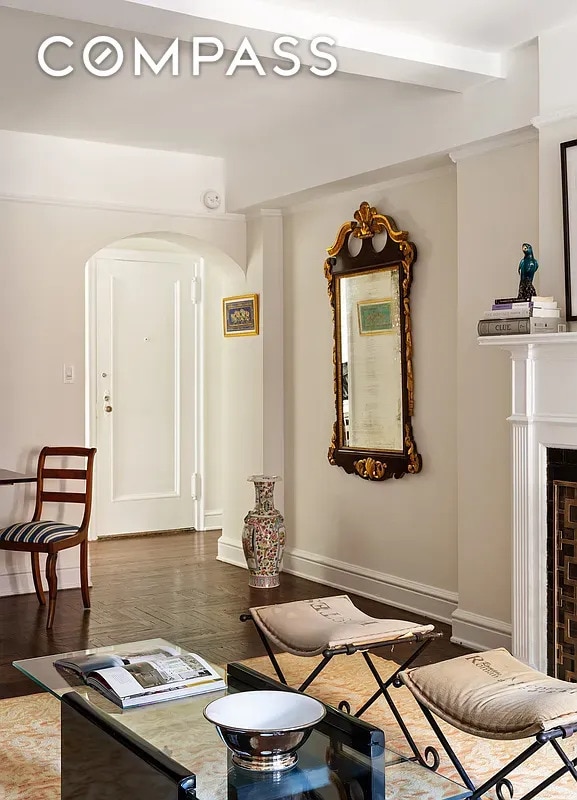 151 E 83rd St Unit 5E, New York City, NY 10028 - living room with arched walkways and wood finished floors