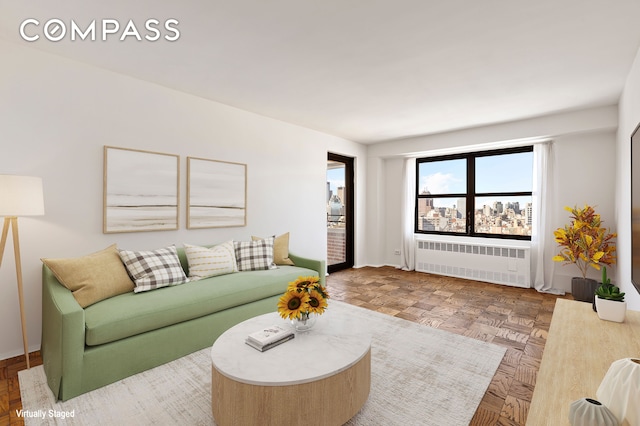 living room featuring radiator heating unit and baseboards