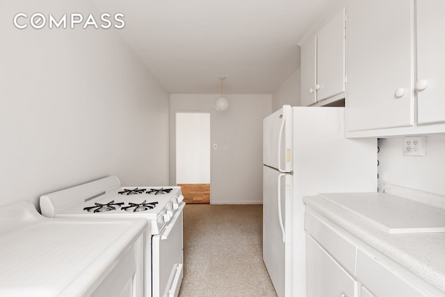 kitchen featuring white cabinets, light carpet, white appliances, and light countertops