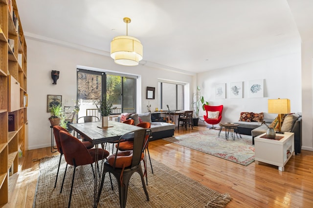 dining space featuring light wood finished floors