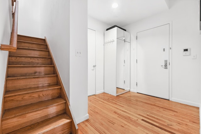 69 E 130th St Unit 1C, New York City, NY 10037 - staircase with baseboards and wood finished floors
